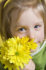 Image showing Girl and yellow flowers