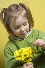 Image showing Girl and yellow flowers