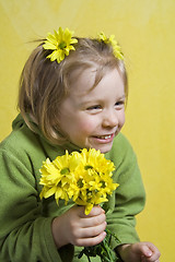 Image showing Girl and yellow flowers