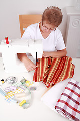 Image showing Elderly woman sewing