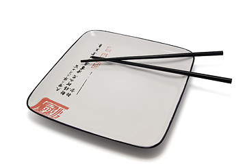 Image showing Empty plate and chopsticks