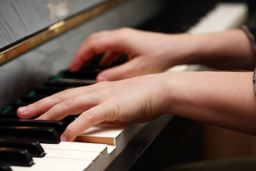 Image showing Hands playing piano