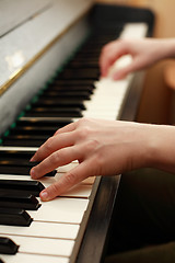 Image showing Hands playing piano