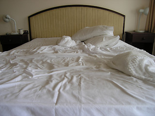 Image showing Hotel bed after use.