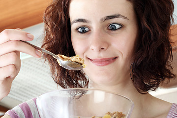 Image showing Young people eating milk with cereals