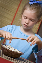 Image showing Eating rice