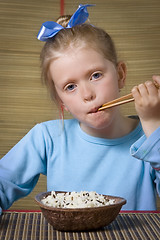 Image showing Eating rice