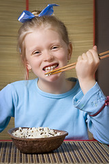 Image showing Eating rice