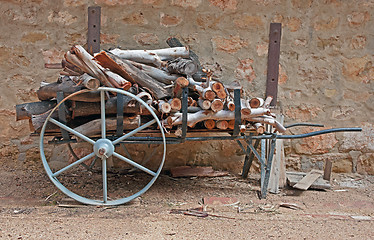 Image showing old cart with logs