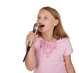 Image showing young girl singing karaoke on white