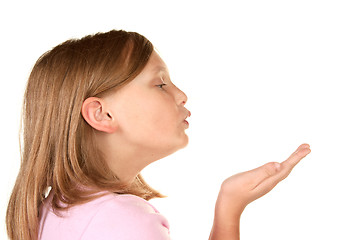 Image showing a young girl blowing a kiss