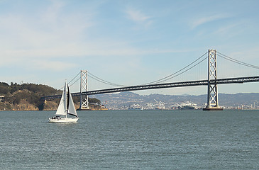 Image showing Sailboat, island and a bridge