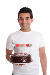 Image showing Smiling man with a birthday cake