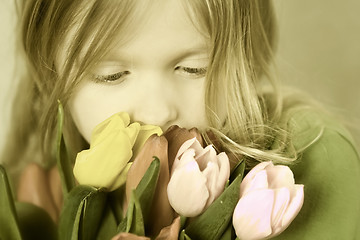 Image showing Girl and tulps