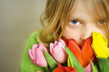 Image showing Girl and tulps