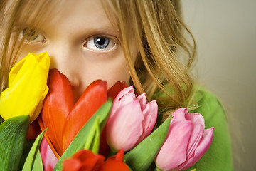 Image showing Girl and tulps