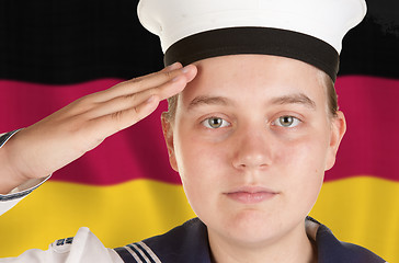 Image showing young sailor saluting isolated white background