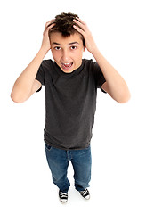 Image showing Stressed boy hands to head