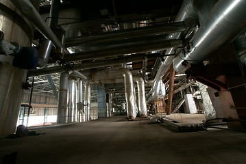 Image showing Equipment, cables and piping as found inside of a modern industr