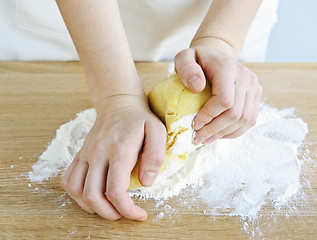 Image showing Hands kneading dough