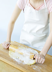 Image showing Rolling out cookie dough