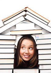 Image showing Woman surrounded by books