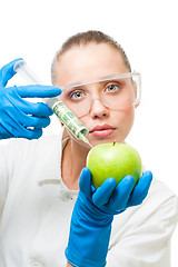 Image showing dollar injection into green apple
