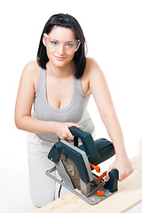 Image showing Woman with electric saw