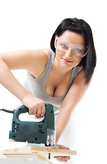 Image showing Positive woman work with wood