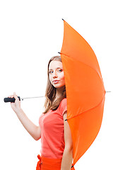 Image showing Woman hide behind umbrella