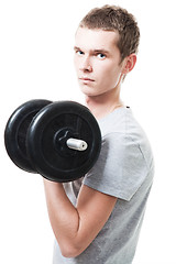 Image showing Concentrated young man lift weights