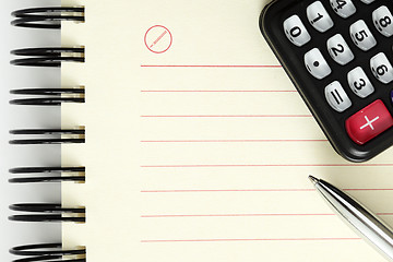 Image showing Clean sheet of notebook with pen and calculator