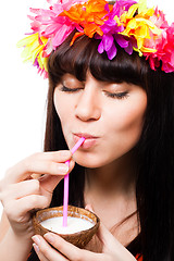 Image showing Young woman drink coconut milk from shell