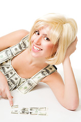 Image showing Woman fit puzzle of dollar