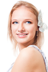 Image showing Blond woman with butterfly in her hair smile