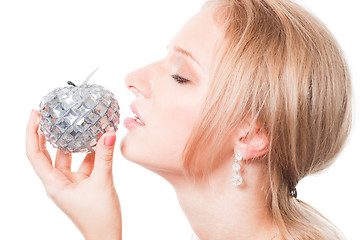 Image showing Blond woman trying bible apple