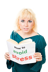 Image showing Stressed woman with book