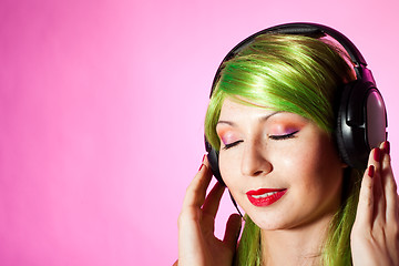 Image showing Happy woman listen music