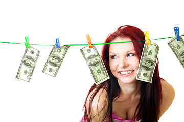 Image showing Shocked woman with cash wash money
