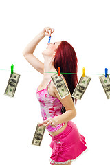 Image showing Shocked woman with cash wash money