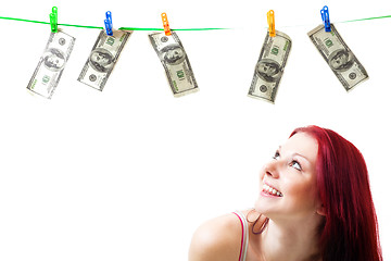 Image showing Shocked woman with cash wash money