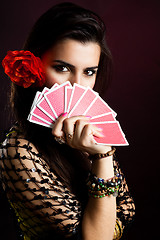 Image showing Gypsy woman with fan of cards