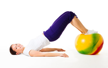 Image showing Happy woman doing fitness exercises with ball