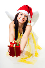 Image showing Angel with white wings give present