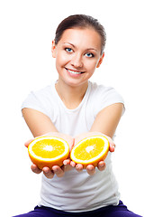 Image showing Happy young woman offer orange