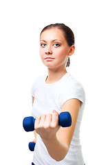 Image showing Confident young woman hold dumbbells