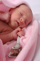 Image showing Baby born with silver spoon in her mouth