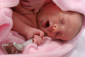 Image showing Baby born with silver spoon in her mouth