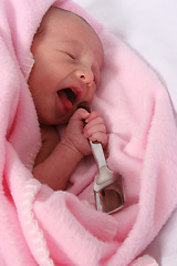 Image showing Baby born with silver spoon in her mouth