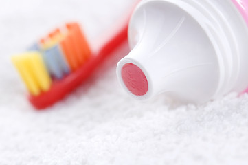 Image showing toothbrush and strawberry tooth paste